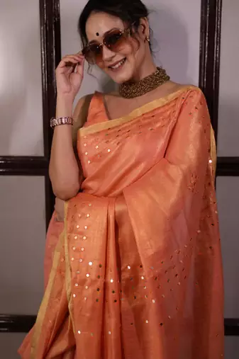 Orange handwoven tissue linen saree with mirror work