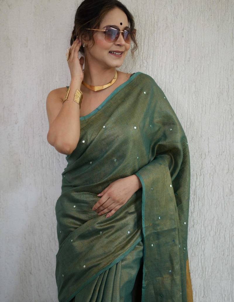 handwoven green tissue linen saree with mirror work