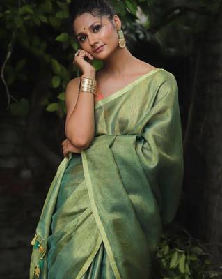 handwoven green tissue linen saree 2