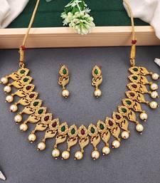 Matte gold peacock necklace set with ruby & green stones, pearl drops     ethnic bridal jewellery