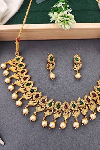 Matte gold peacock necklace set with ruby & green stones, pearl drops – ethnic bridal jewellery