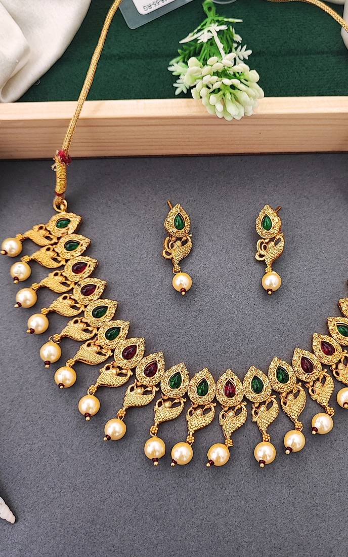 Matte gold peacock necklace set with ruby & green stones, pearl drops – ethnic bridal jewellery