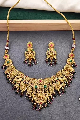 Antique gold-plated temple necklace set with lakshmi & peacock design – traditional bridal jewellery