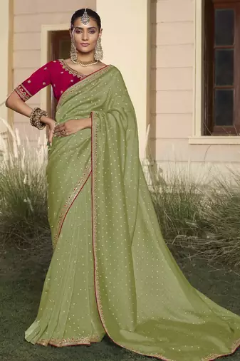 Green embroidered fancy fabric saree with designer blouse fabric