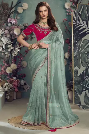 Rama embroidered fancy fabric saree with designer blouse fabric
