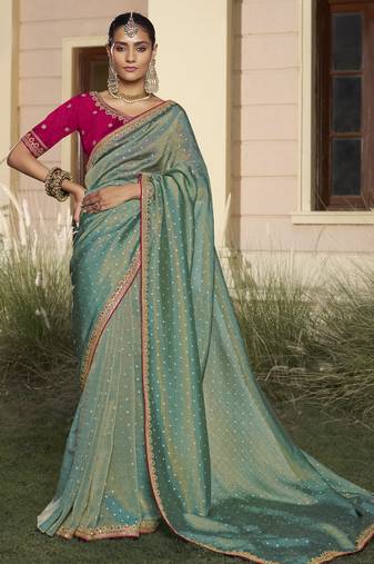 Rama embroidered fancy fabric saree with designer blouse fabric