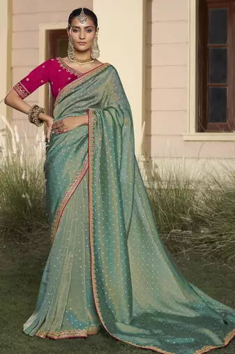 Rama embroidered fancy fabric saree with designer blouse fabric