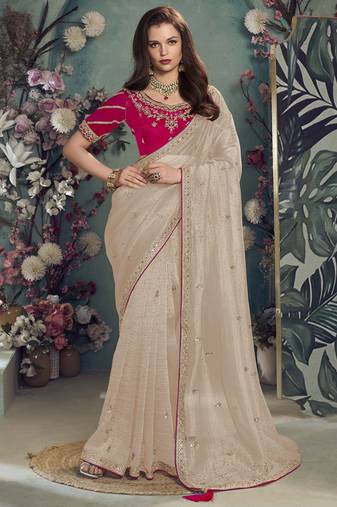 Chiku embroidered fancy fabric saree with designer blouse fabric
