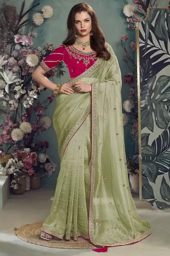 Green embroidered fancy fabric saree with designer blouse fabric