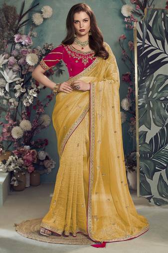 Yellow embroidered fancy fabric saree with designer blouse fabric