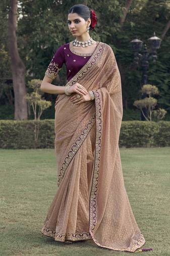 Peach embroidered fancy fabric saree with designer blouse fabric