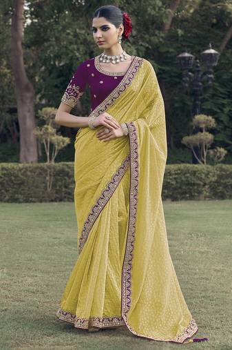Yellow embroidered fancy fabric saree with designer blouse fabric