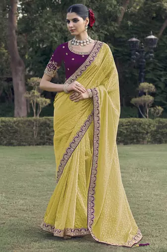 Yellow embroidered fancy fabric saree with designer blouse fabric