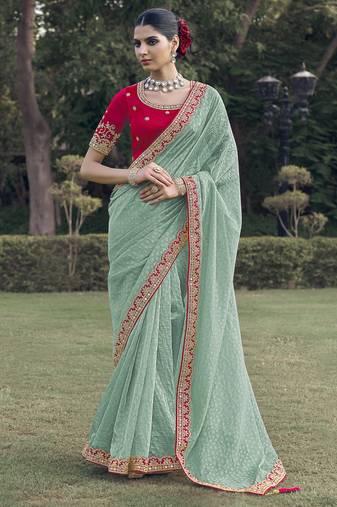 Sea green embroidered fancy fabric saree with designer blouse fabric