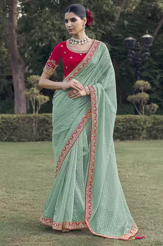 Sea green embroidered fancy fabric saree with designer blouse fabric