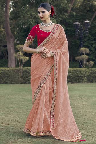 Pink embroidered fancy fabric saree with designer blouse fabric