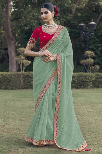 Green embroidered fancy fabric saree with designer blouse fabric
