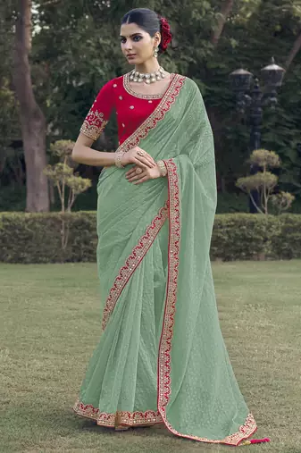 Green embroidered fancy fabric saree with designer blouse fabric