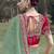 Green embroidered fancy fabric saree with designer blouse fabric
