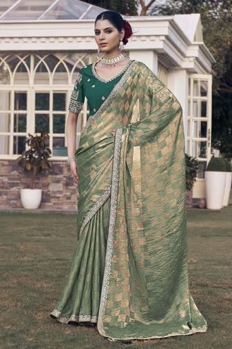 Green embroidered fancy fabric saree with designer blouse fabric
