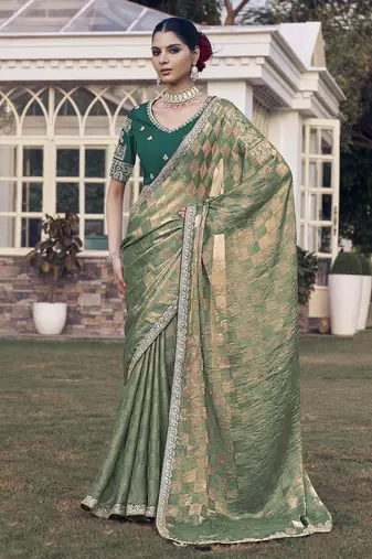 Green embroidered fancy fabric saree with designer blouse fabric