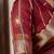 maroon linen zari woven saree with unstitched blouse