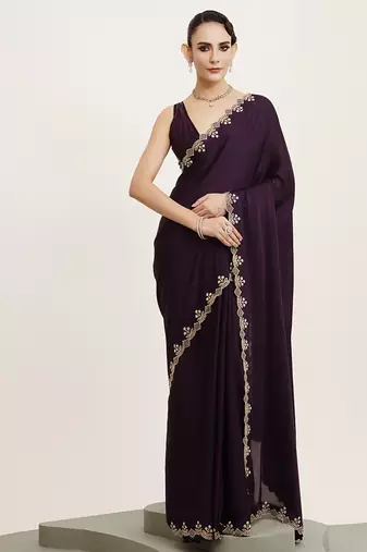 Purple satin saree with stone embellishment and blouse