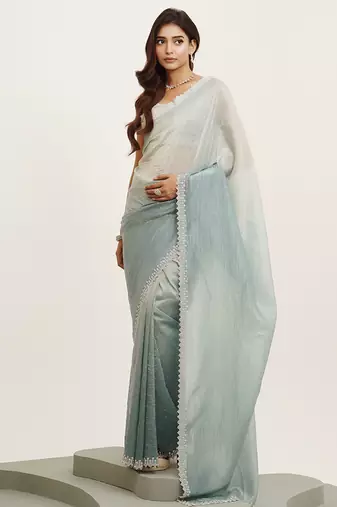 Turquoise blue tissue saree with beads work and blouse