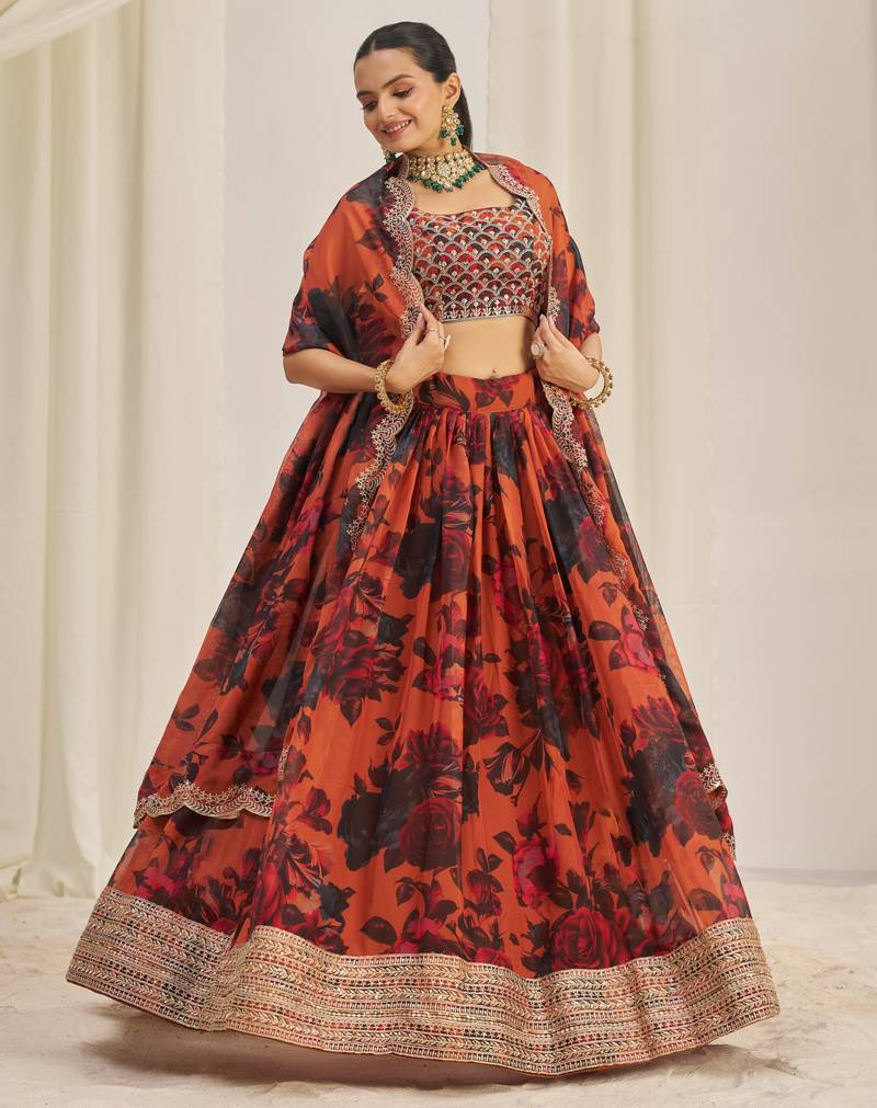 ORANGE ZARI SEQUINS EMBROIDEREY FLORAL PRINTED ORGANZA LEHENGA CHOLI