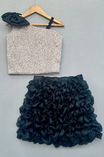 Silver sequin top with black ruffled skirt
