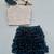 Silver sequin top with black ruffled skirt