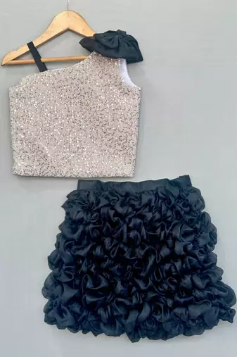 Silver sequin top with black ruffled skirt