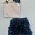 Silver sequin top with black ruffled skirt