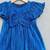 Royal blue pleated party dress with oversized bow