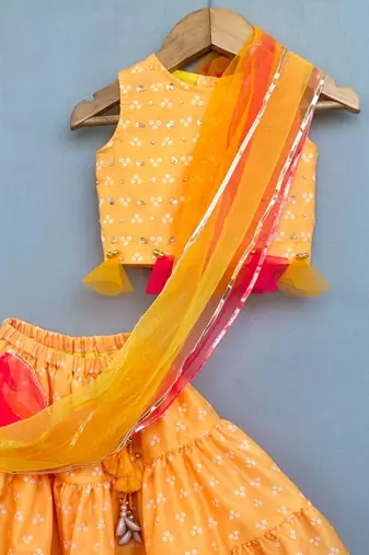 Yellow bandhni lehenga set with attached dupatta