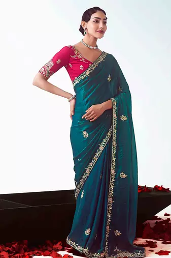 Teal embroidered cut work fancy fabric ceremonial designer saree