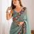Latest designer heavy embroidery border  tissue festival wear green saree