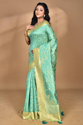 green zari silk blend saree with blouse piece