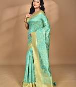 green zari silk blend saree with blouse piece