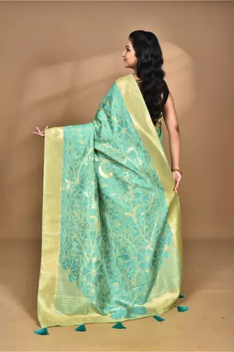 green zari silk blend saree with blouse piece