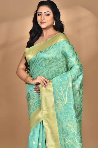 green zari silk blend saree with blouse piece