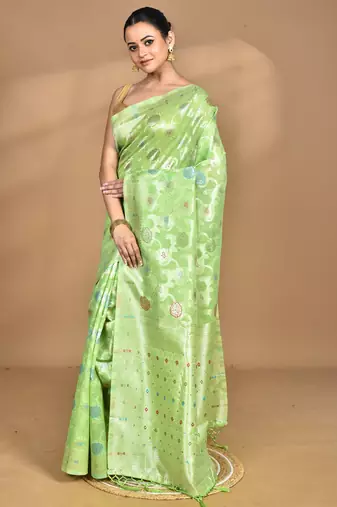 green chanderi silk blend saree with blouse piece