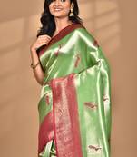 green banarasi silk blend saree with blouse piece