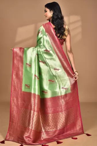 green banarasi silk blend saree with blouse piece
