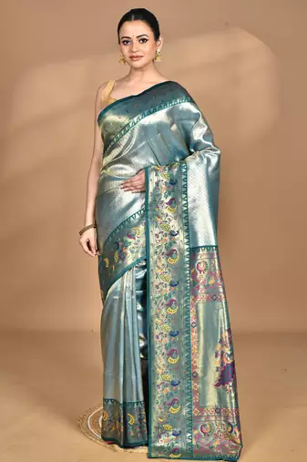 green banarasi silk blend saree with blouse piece
