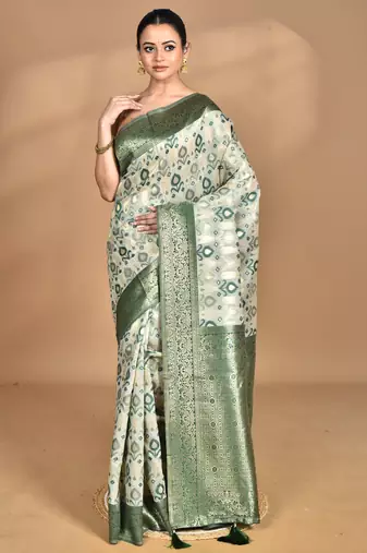 green chanderi silk blend saree with blouse piece