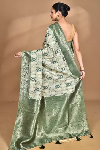 green chanderi silk blend saree with blouse piece