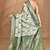 green chanderi silk blend saree with blouse piece