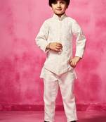 White embroidered satin jacket paired with pant