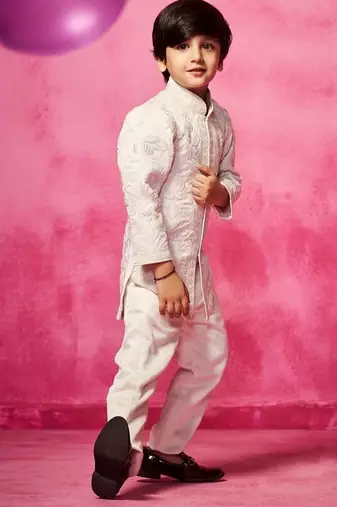 White embroidered satin jacket paired with pant